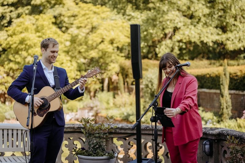 Sarah and Ben performing at a corporate event